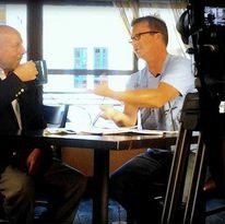 Rick Senninger on TV set with producer